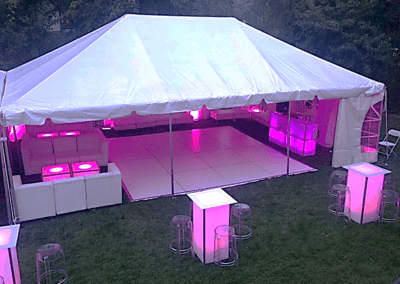a wedding tent set up, with LED furniture inside